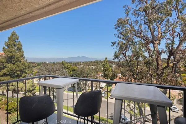 a view of a balcony with chairs