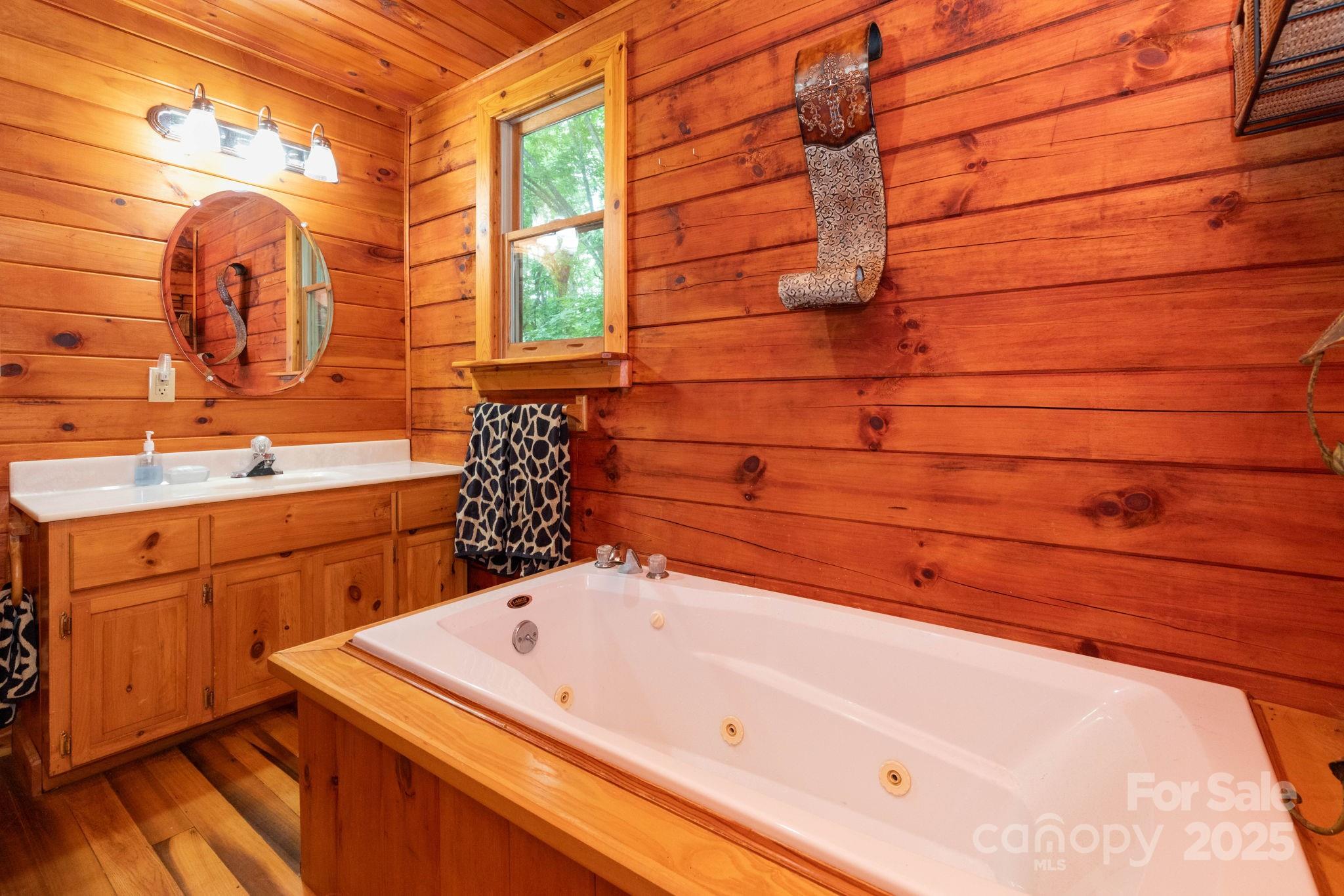 192 Granny Shepherd Road Mars Hill, NC 28754 - Photo 12 of 26 a bathroom with a bathtub and shower