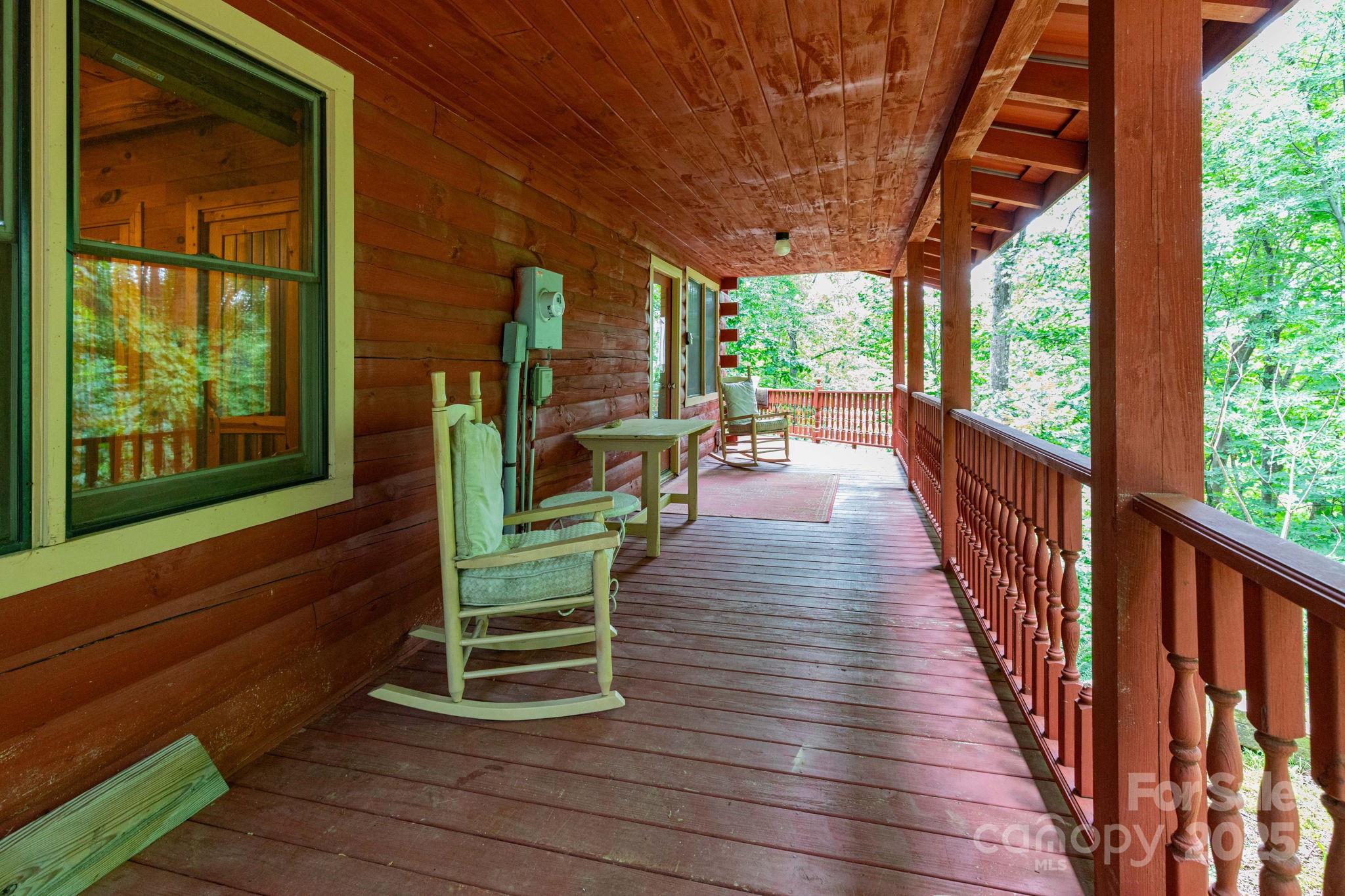 192 Granny Shepherd Road Mars Hill, NC 28754 - Photo 2 of 26 a porch with wooden floor outdoor seating and yard