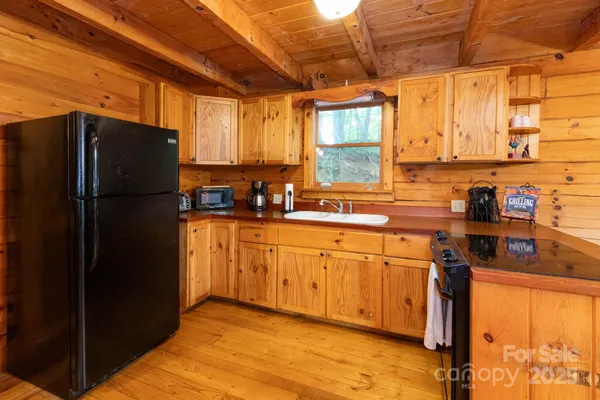 a kitchen with stainless steel appliances a refrigerator and sink