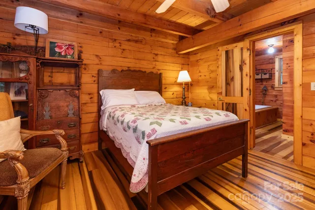 a bed sitting in a bedroom next to a building