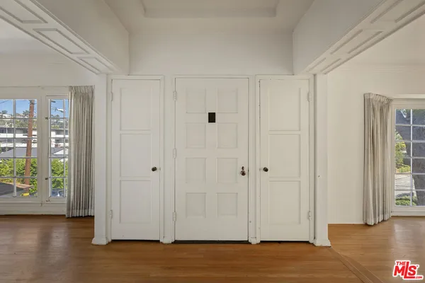 a view of entryway with wooden floor