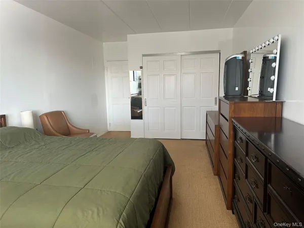 a bedroom with a bed and a walk in closet