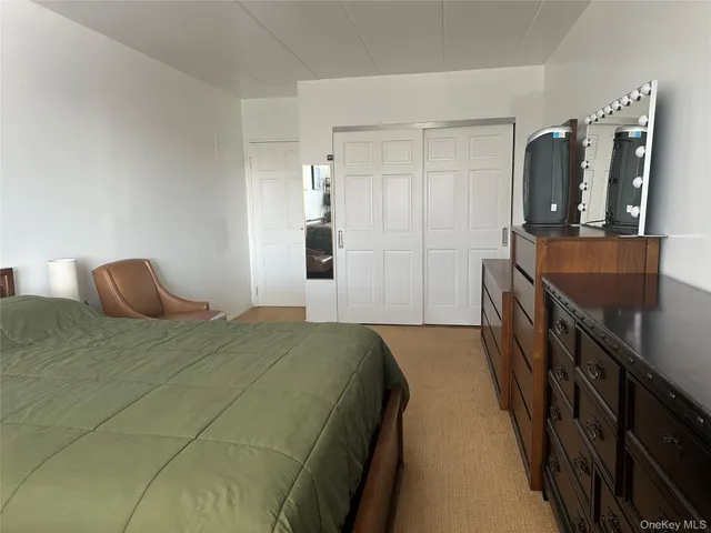 a bedroom with a bed and a walk in closet