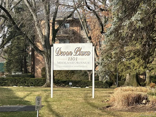 a view of a building with a yard