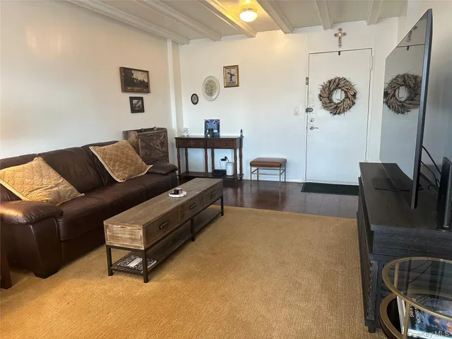 a living room with furniture and a rug