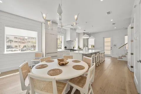 a bathroom with a bathtub sink and mirror