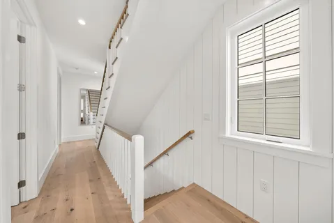 a bedroom with a bed and a painting