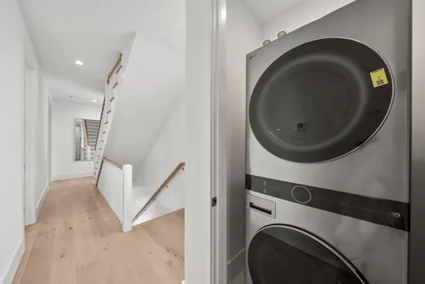 a bathroom with a double vanity sink mirror and shower