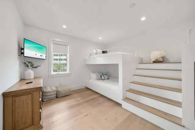 a bedroom with furniture and a window