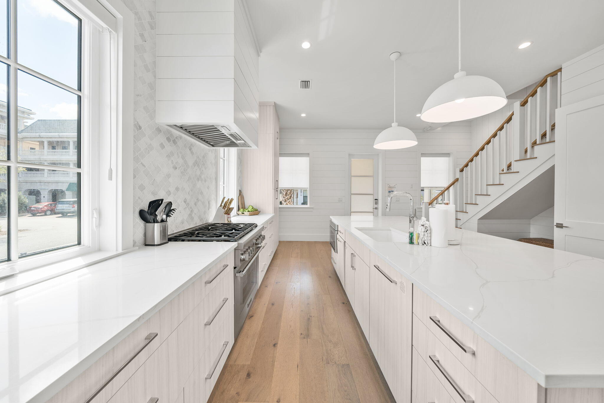69 Trigger Trail Inlet Beach Inlet Beach, FL 32461 - Photo 7 of 50 a large white kitchen with lots of counter space a sink and a large window