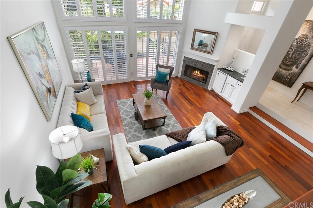 6051 Shadowbrook Circle Huntington Beach, CA 92648 - Photo 12 of 42 a living room with furniture fireplace and flat screen tv