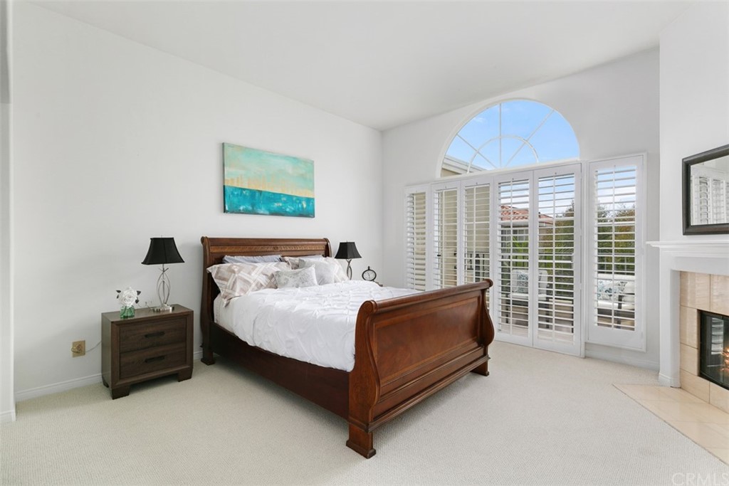 6051 Shadowbrook Circle Huntington Beach, CA 92648 - Photo 25 of 42 a bed sitting in a bedroom next to a window
