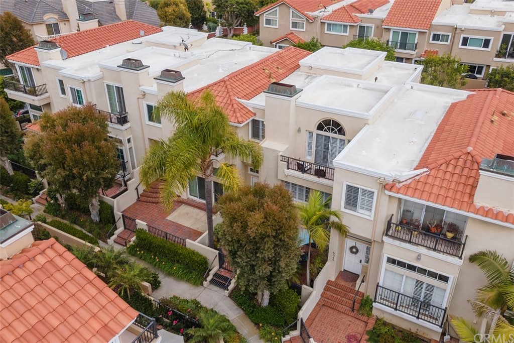 6051 Shadowbrook Circle Huntington Beach, CA 92648 - Photo 3 of 42 an aerial view of residential houses with outdoor space