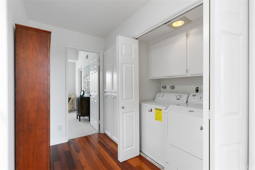 6051 Shadowbrook Circle Huntington Beach, CA 92648 - Photo 33 of 42 a view of storage and utility room with wooden floor