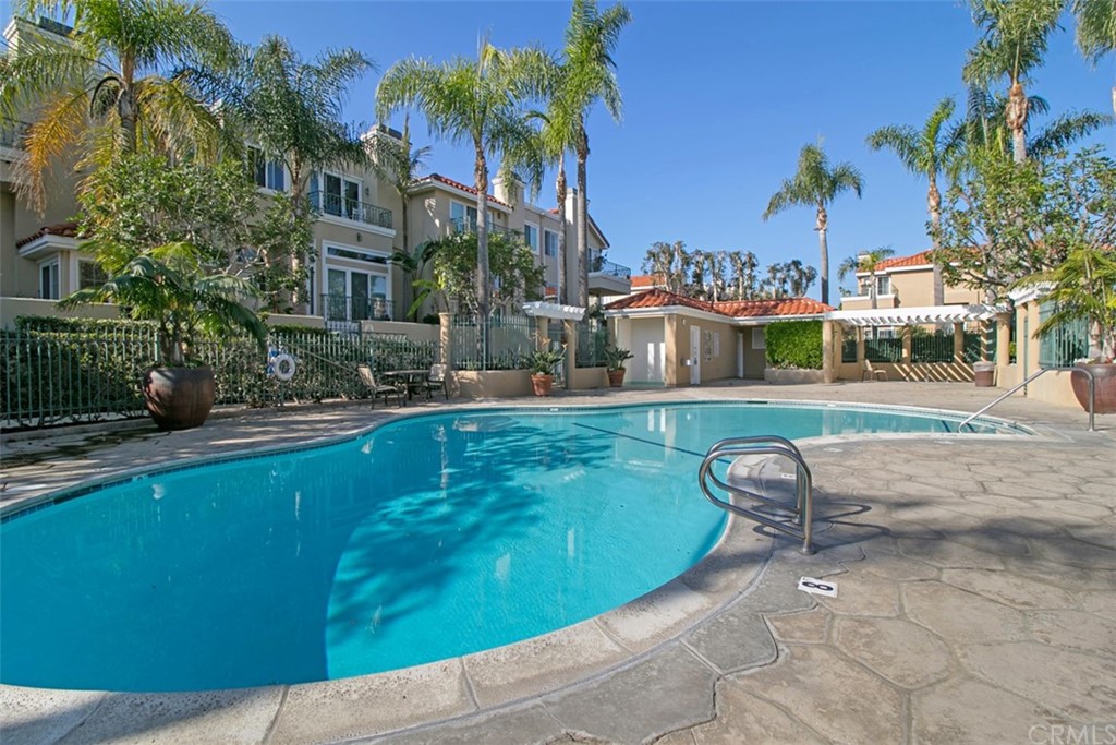 6051 Shadowbrook Circle Huntington Beach, CA 92648 - Photo 38 of 42 a view of a swimming pool with a patio