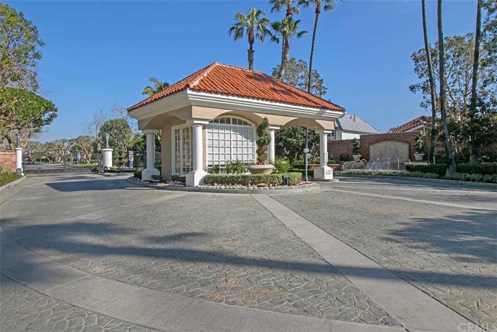 6051 Shadowbrook Circle Huntington Beach, CA 92648 - Photo 41 of 42 front view of a building with a street