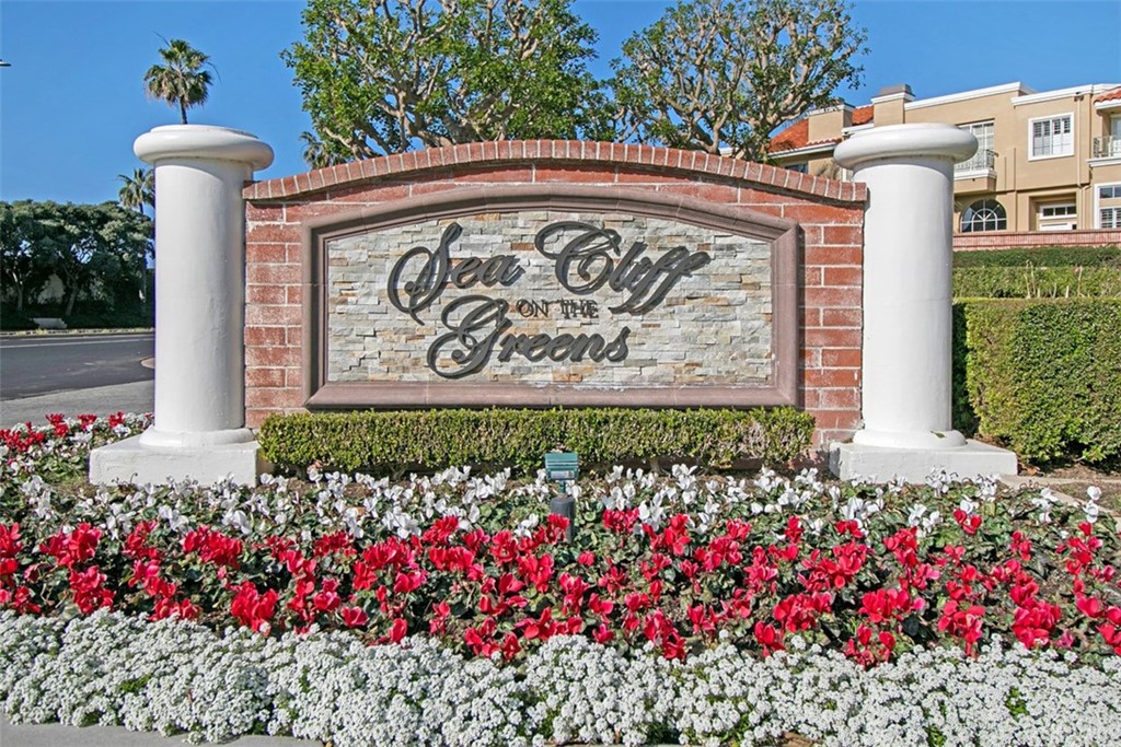 6051 Shadowbrook Circle Huntington Beach, CA 92648 - Photo 42 of 42 a view of sign board with flower around