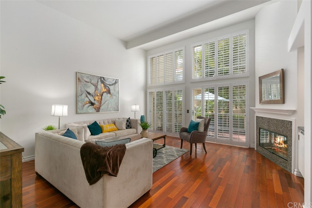 6051 Shadowbrook Circle Huntington Beach, CA 92648 - Photo 9 of 42 a living room with furniture and a fireplace