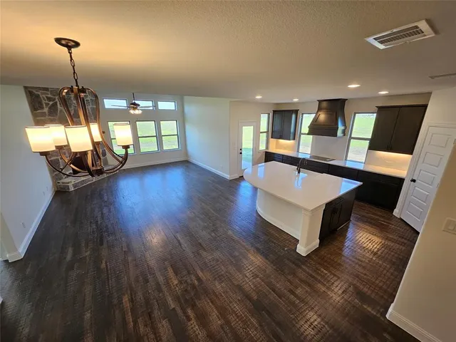 a living room with couch and wooden floor
