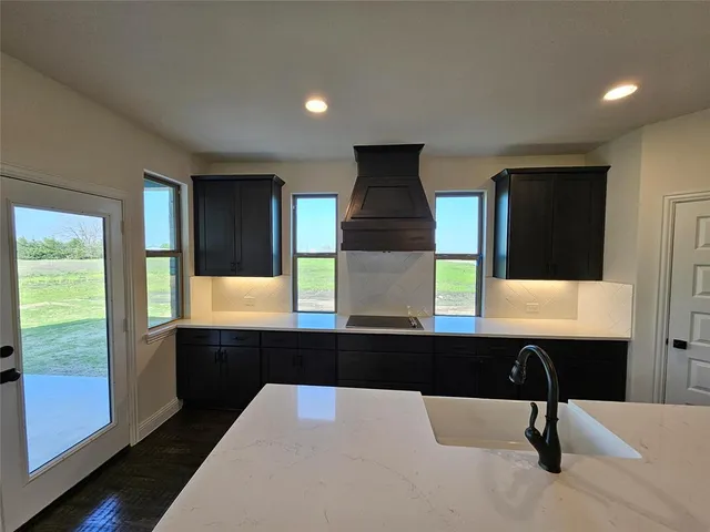 a kitchen with a table and chairs