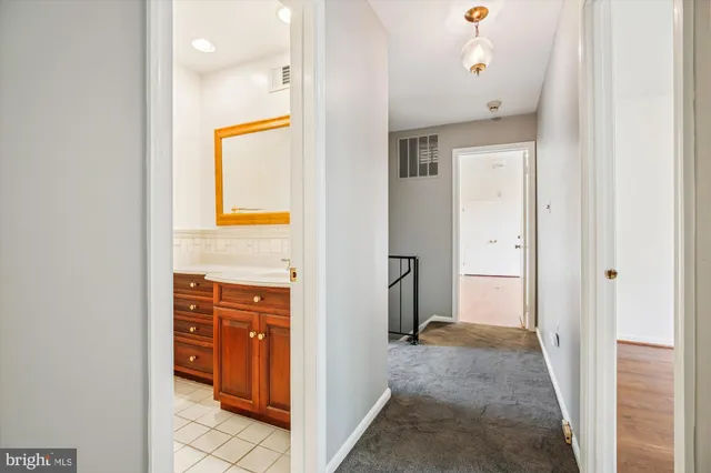 a view of a hallway to a bedroom