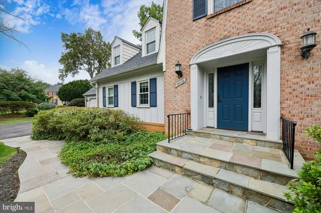 a view of a house with potted plants