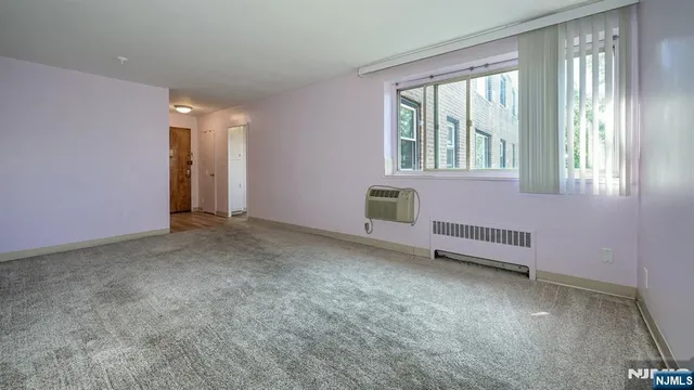 a view of a bathroom with a shower and a sink