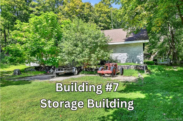 a view of outdoor space with sign board and garden