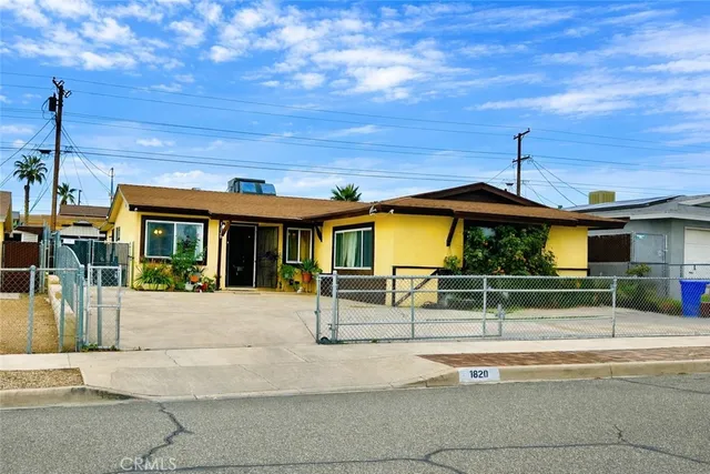 a view of kitchen with stainless steel appliances kitchen island granite countertop a stove and a sink