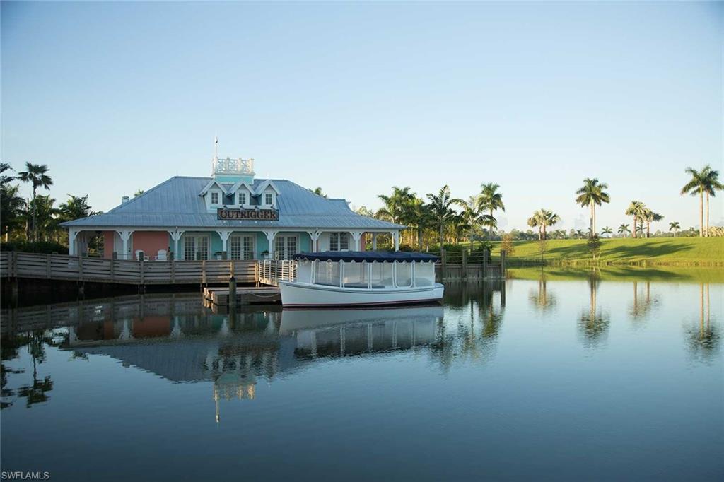 14715 Edgewater Circle Naples, FL 34114 - Photo 9 of 15 a front view of a house with a lake view