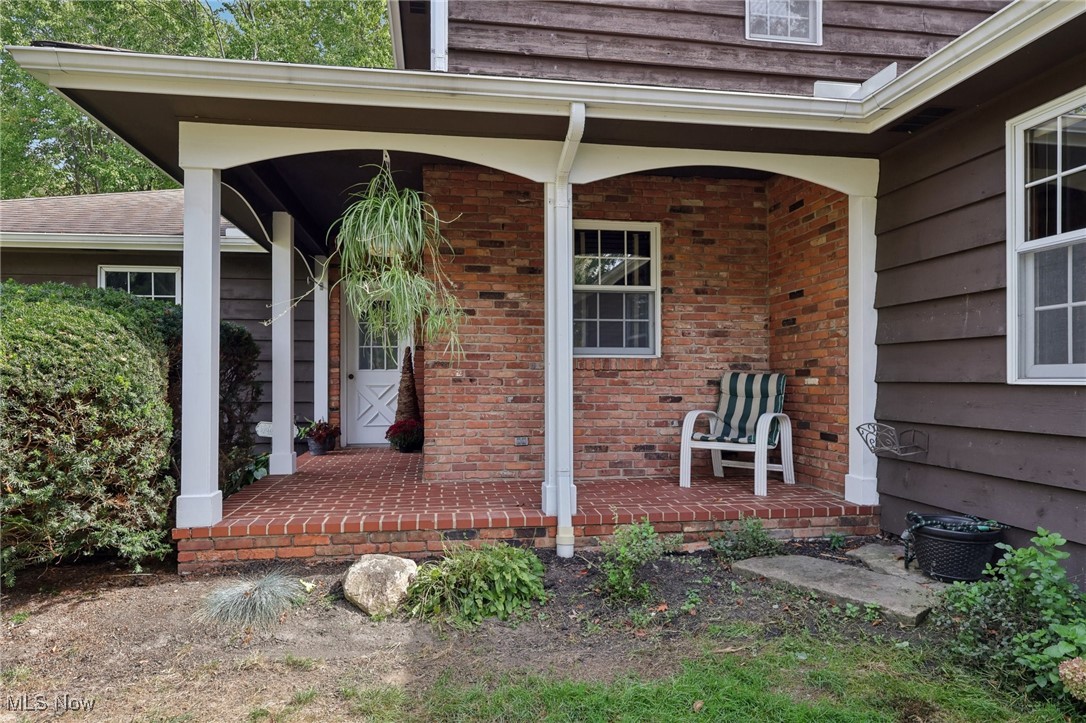 16737 Claridon Troy Road Burton, OH 44021 - Photo 3 of 46 The wrap around brick walled front porch provides a cozy place to relax