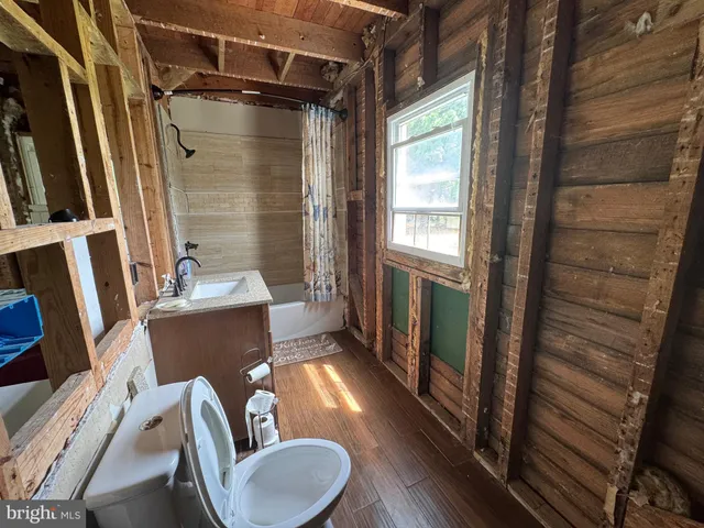 a bathroom with a toilet a sink and a bathtub