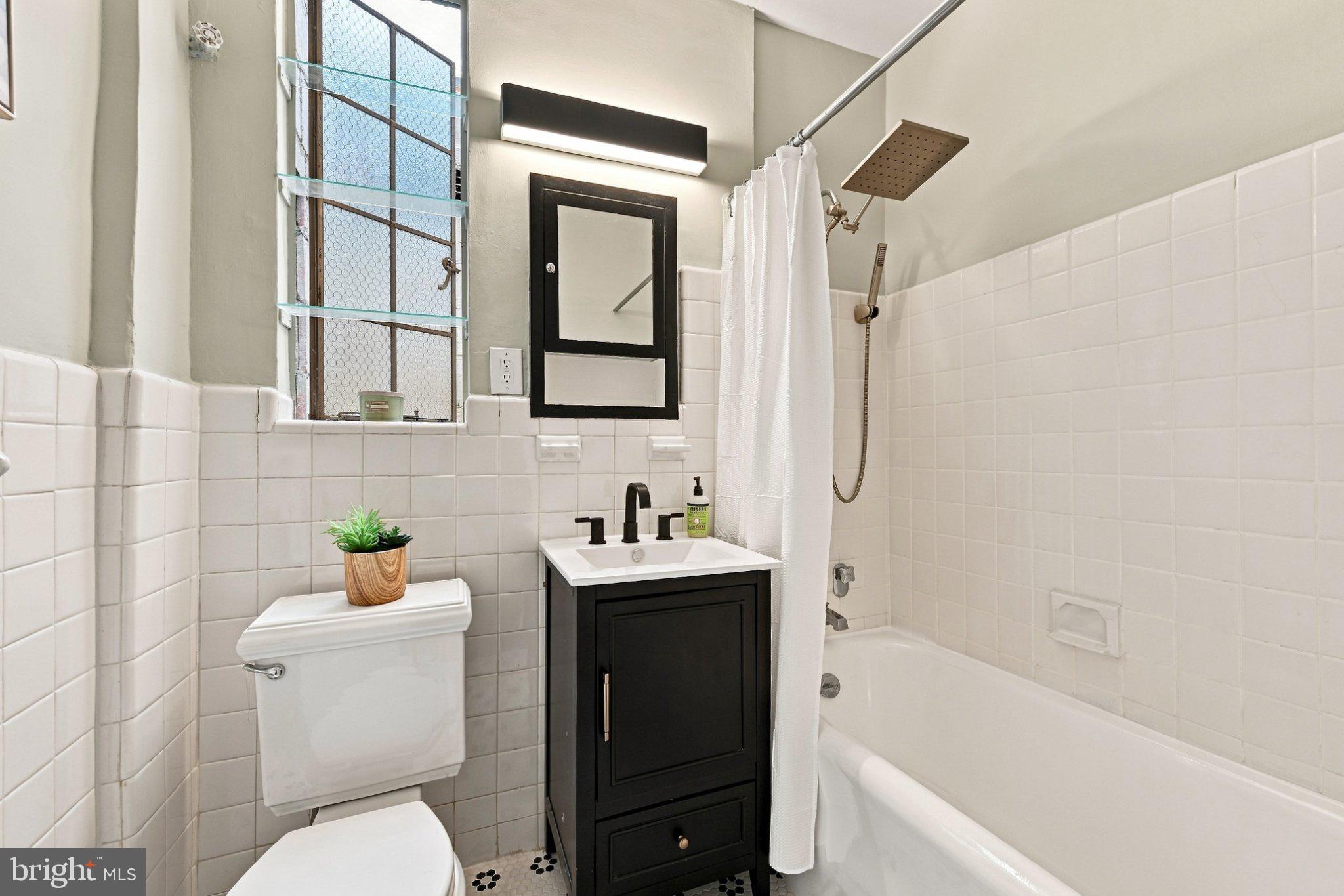 2032 Belmont Road Northwest, Unit 632 Washington, DC 20009 - Photo 21 of 31 Charming bathroom with modern touches.