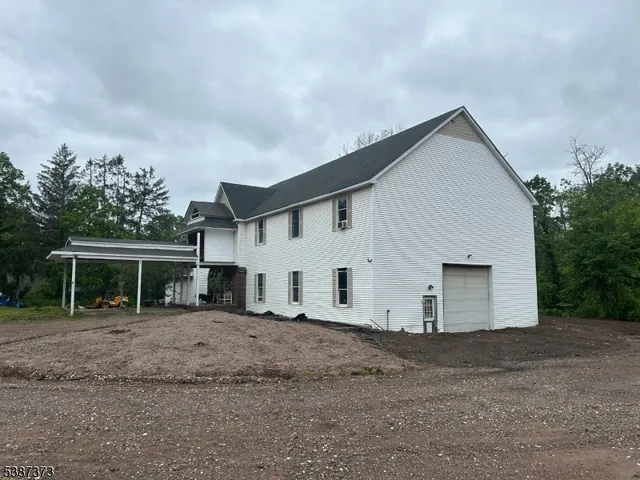 a view of house with a yard