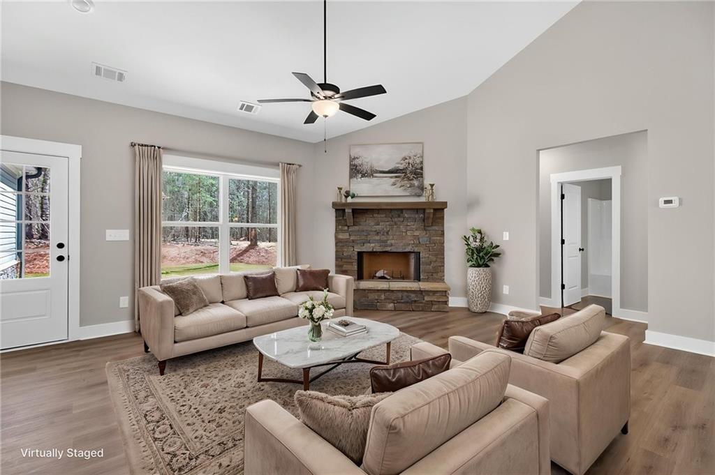 423 Relay Road Silver Creek, GA 30173 - Photo 8 of 48 a living room with furniture and a fireplace