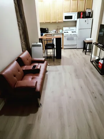 a room with furniture and a wooden floor