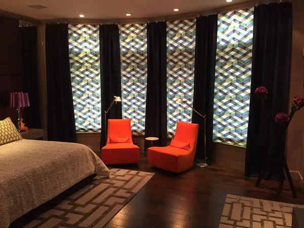 a bedroom with furniture and a flat screen tv