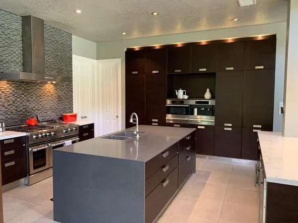 a kitchen with a sink and stove