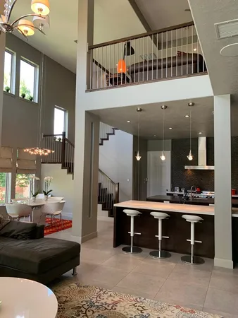 a lobby with furniture and a rug