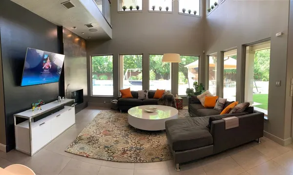 a living room with furniture and a flat screen tv