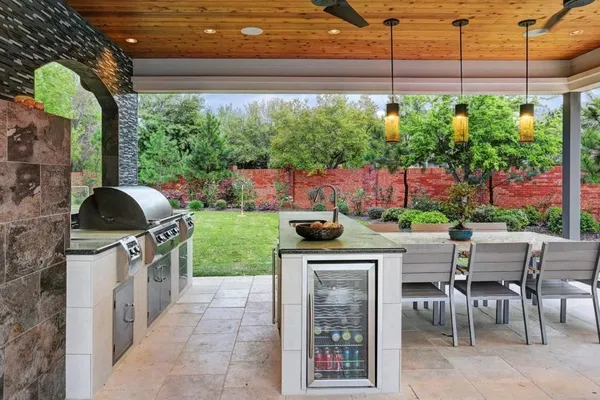 a view of a kitchen with a sink and fire pit