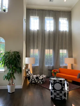 a bedroom with furniture and a potted plant