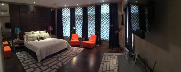 a bedroom with furniture and a window
