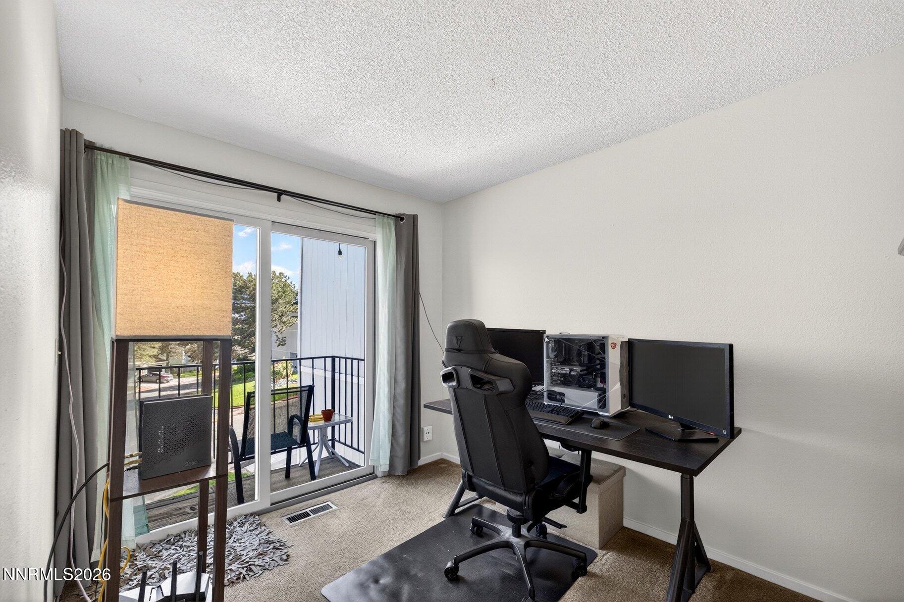 3415 Balboa Drive Reno, NV 89503 - Photo 24 of 61 a view of a workspace with furniture and a window
