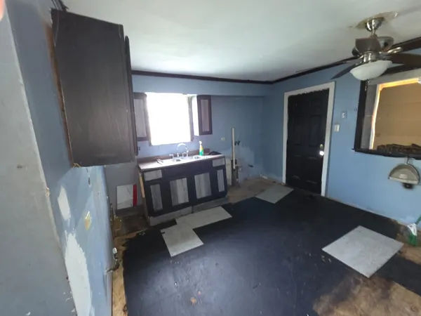 a bedroom with furniture and window