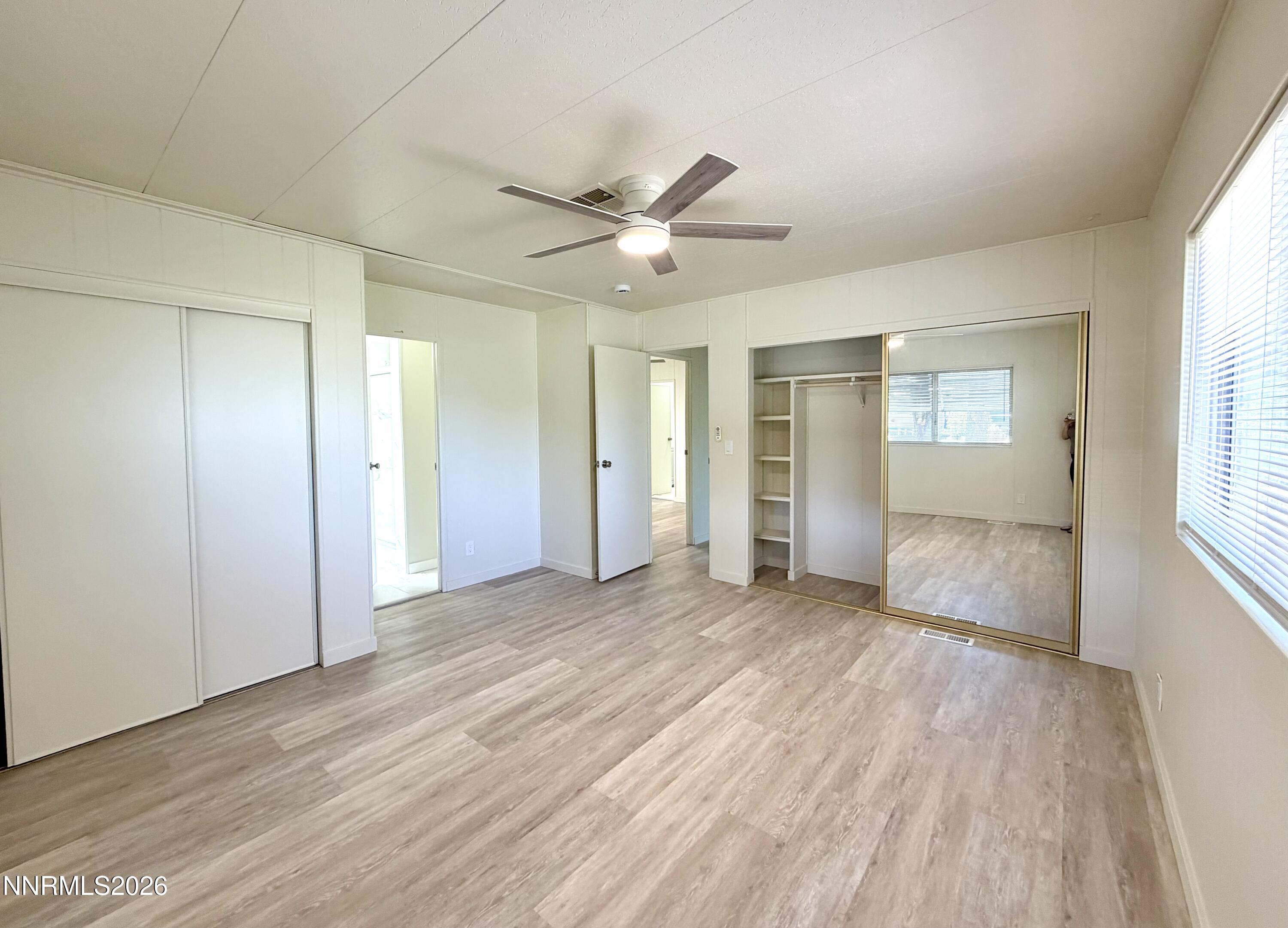 330 Taurus Circle Reno, NV 89521 - Photo 20 of 27 a view of an empty room with window and wooden floor