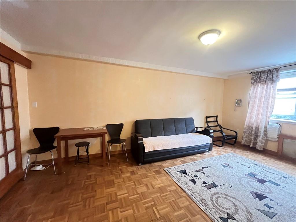 a living room with furniture and a rug