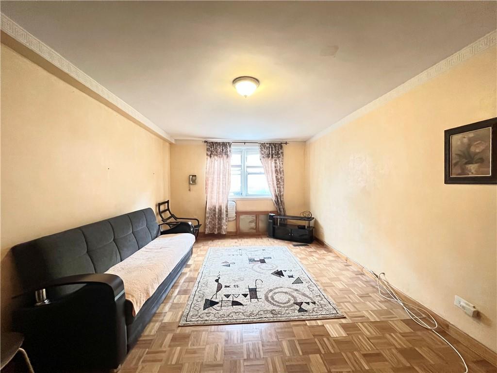 2678 Ocean Avenue, Unit L4 Brooklyn, NY 11229 - Photo 2 of 11 a bedroom with a bed and wooden floor