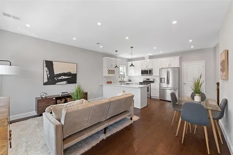 a living room with furniture and a table